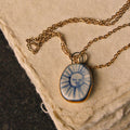 Porcelain Sun Pendant with 24 karat Gold Lustre 